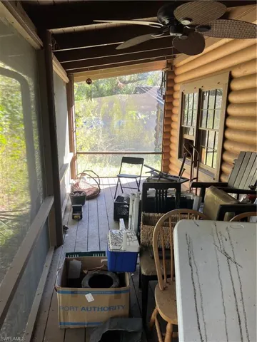 Sunroom / solarium featuring ceiling fan and a wealth of natural light