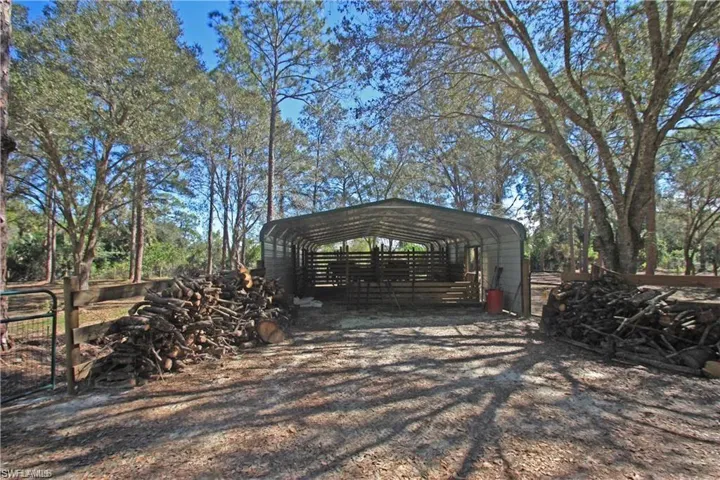 View of outbuilding with a carport
