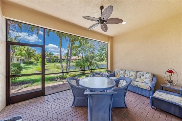 Sunroom featuring ceiling fan