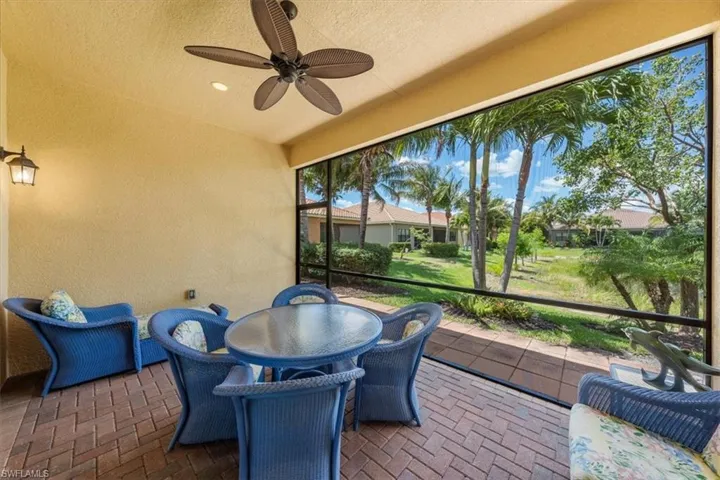 Sunroom / solarium featuring ceiling fan