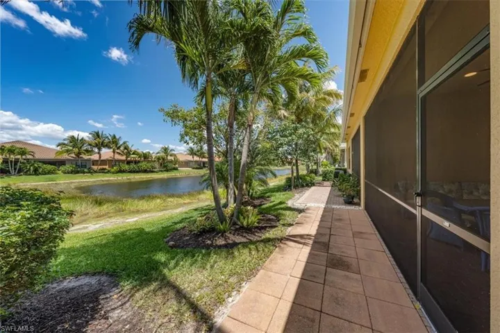 View of yard with a water view