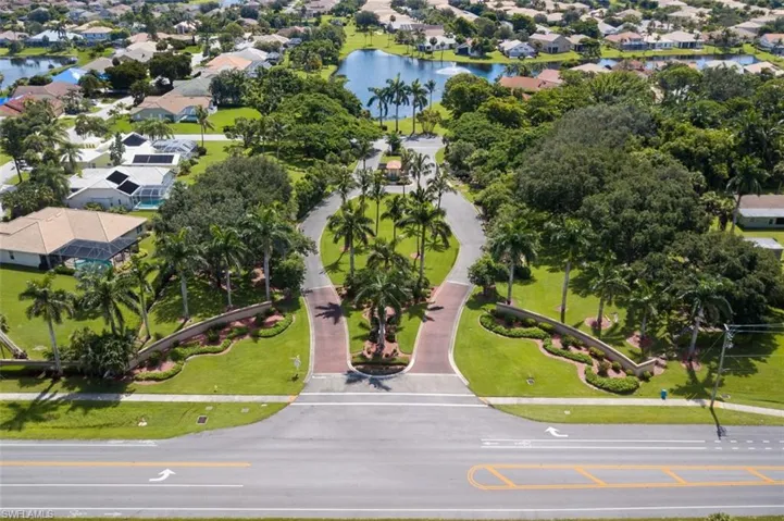 Aerial perspective of suburban area featuring a large body of water