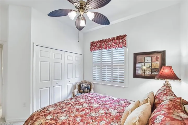 Bedroom featuring a closet and ceiling fan