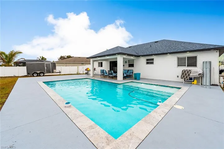 View of swimming pool featuring patio surround, outdoor lounge area, and a fenced backyard