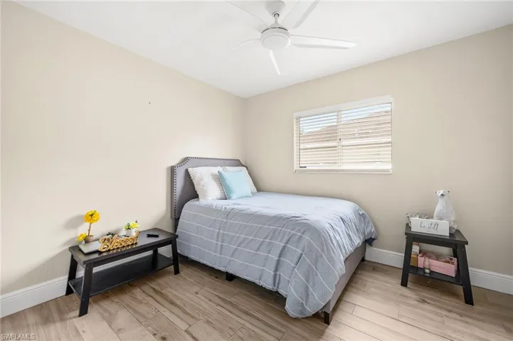 Bedroom with light wood-style flooring and ceiling fan