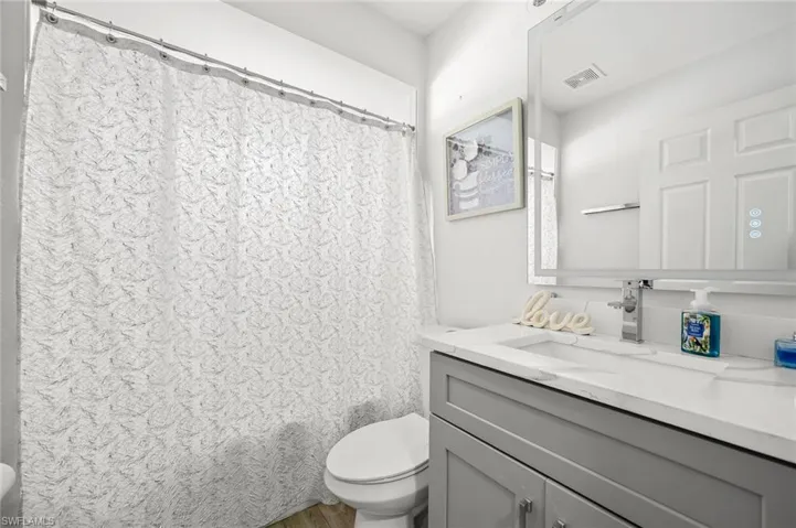 Bathroom with vanity and light wood-style flooring