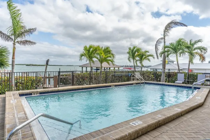 Community pool with a water view
