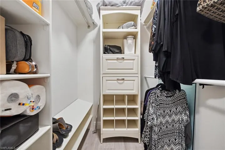 Walk-in closet in primary bedroom