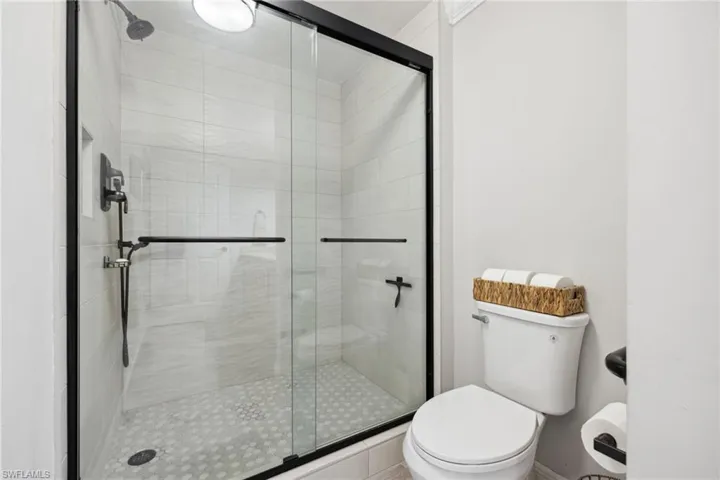 Large walk-in shower with shower handheld