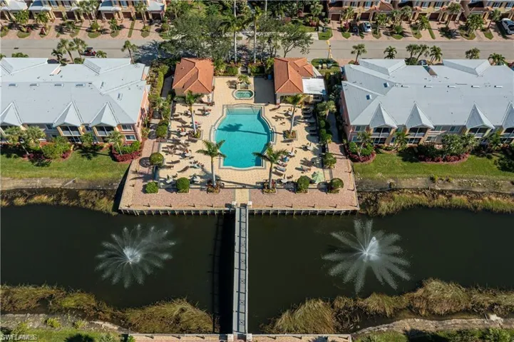 Aerial view featuring a water view & main pool