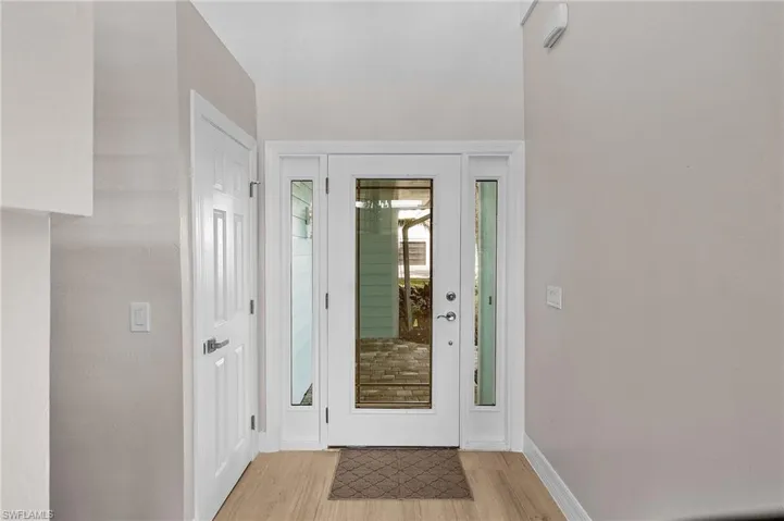 Entryway featuring light wood finished floors and baseboards