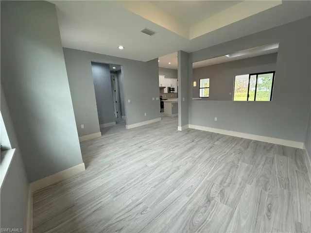 Unfurnished living room with light hardwood / wood-style floors