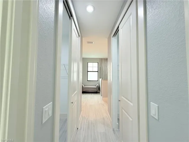Hall featuring light hardwood / wood-style flooring