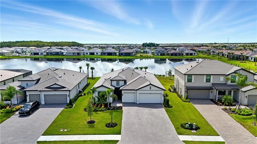 Aerial view of residential area with a large body of water