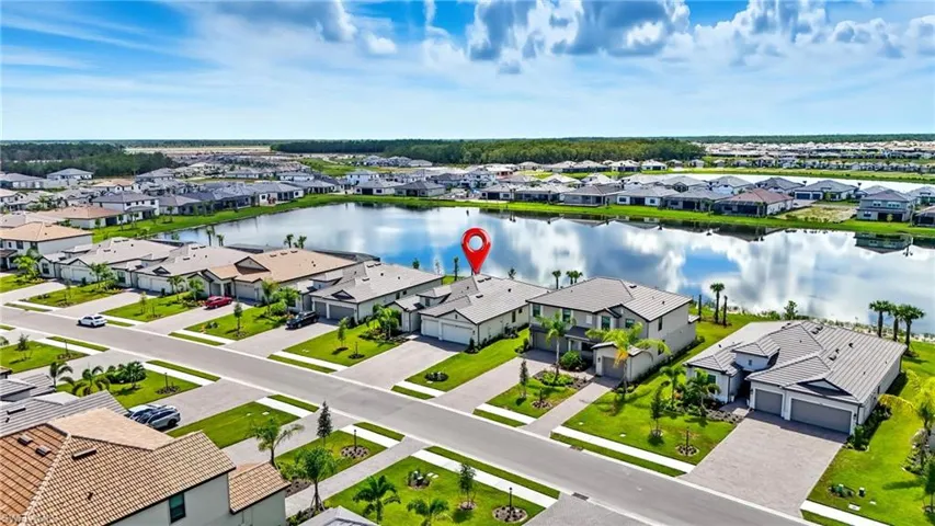 Aerial perspective of suburban area with a large body of water