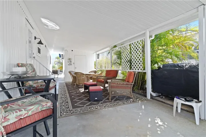 Sunroom / solarium with a patio and outdoor lounge area