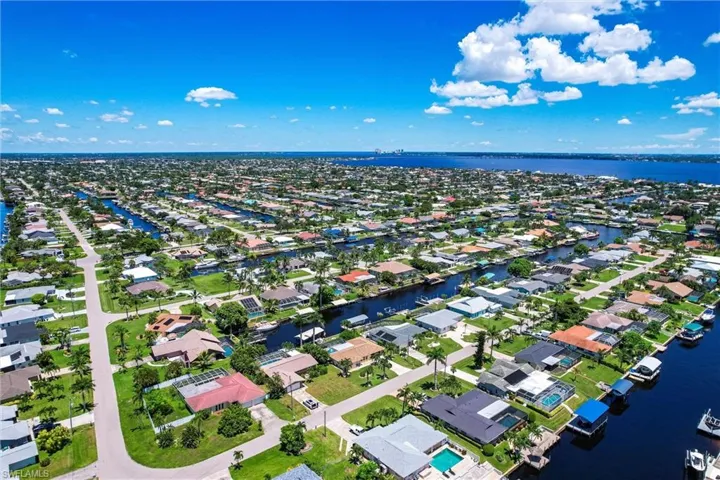 Aerial view of residential area with a large body of water
