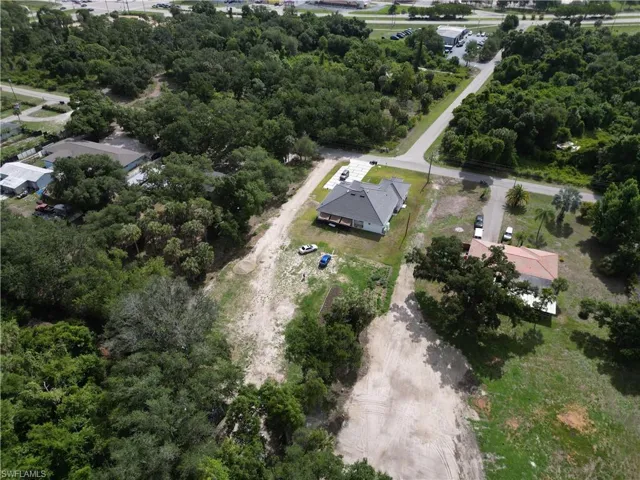 New construction property featuring a grey shingle roof and a covered front porch