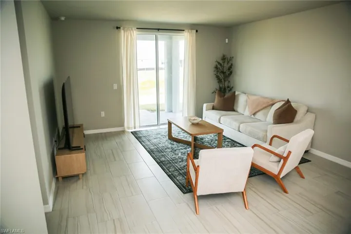 Living room featuring baseboards