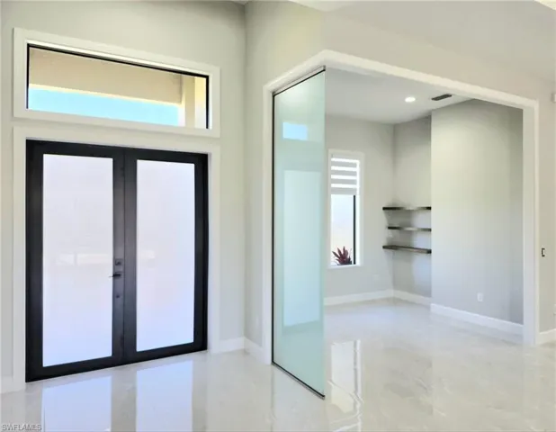 Entryway featuring french doors, baseboards, visible vents, and recessed lighting