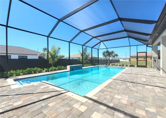 View of pool featuring a fenced in pool, a patio area, and a lanai