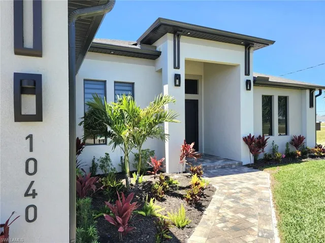 Property entrance featuring stucco siding