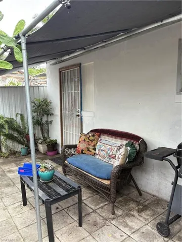 View of patio with shaded mesh covering.