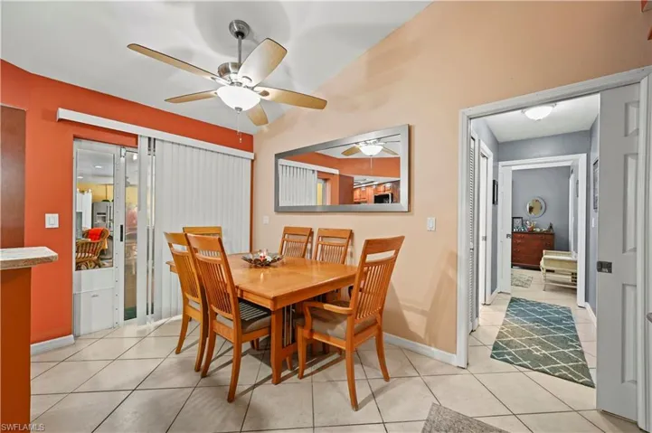 Dining room featuring ceiling fan and light tile patterned floors