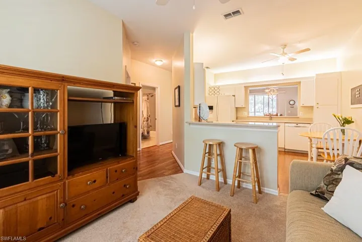 Opens up to kitchen