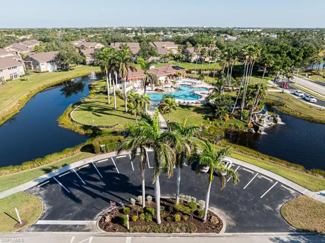 Birds eye view of property featuring a residential view and a water view