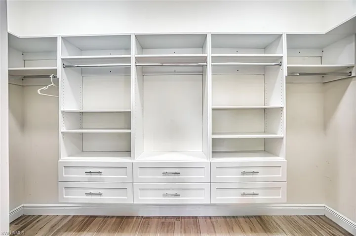 Bedroom with ornamental molding, a closet, and a ceiling fan