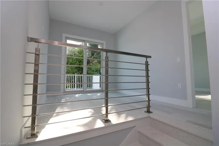 Staircase with lofted ceiling