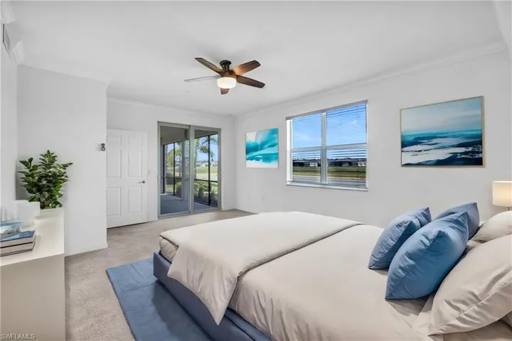 Virtually Staged bedroom with ceiling fan, crown molding, and access to exterior