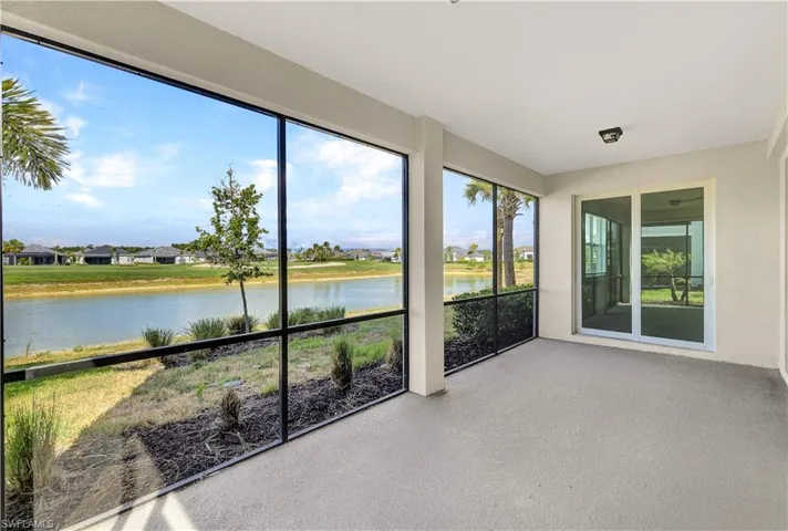 Unfurnished sunroom with a water view