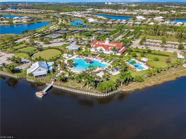 Aerial view of property and surrounding area featuring a large body of water