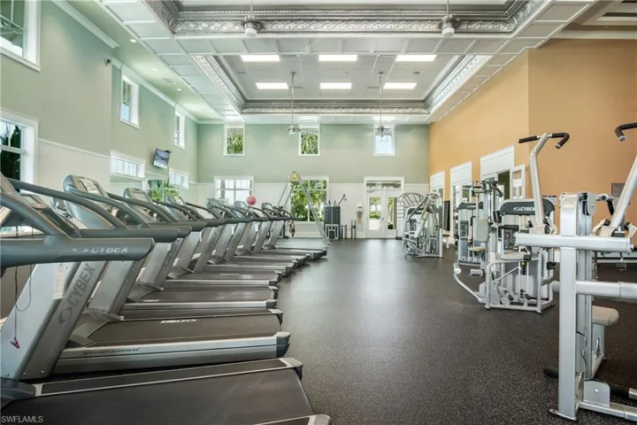 Gym featuring a high ceiling