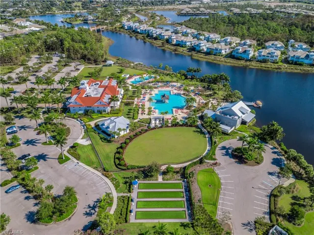 Aerial overview of property's location with nearby suburban area and a large body of water