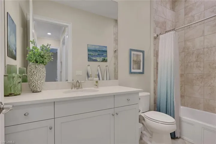 Bathroom with vanity and shower / bath combo