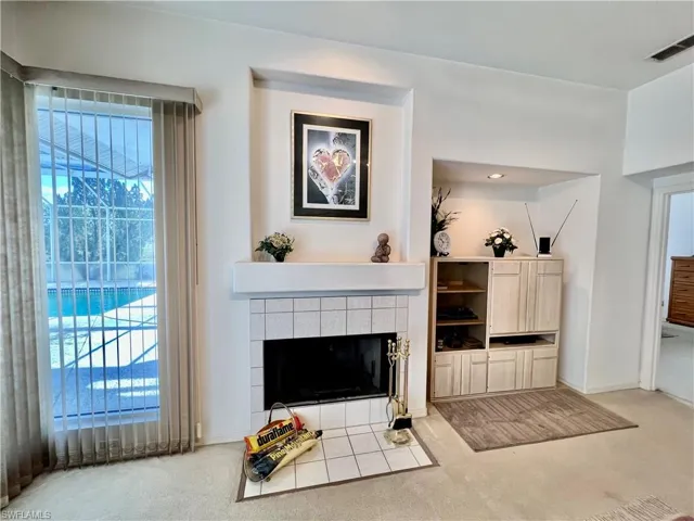 Family room with a tile fireplace.