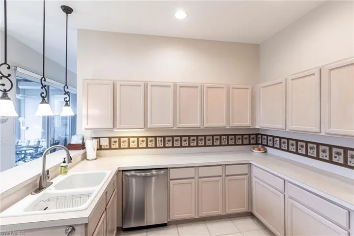 Kitchen featuring pendant lighting, sink and stainless steel dishwasher