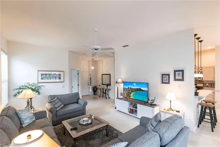 Living room featuring ceiling fan