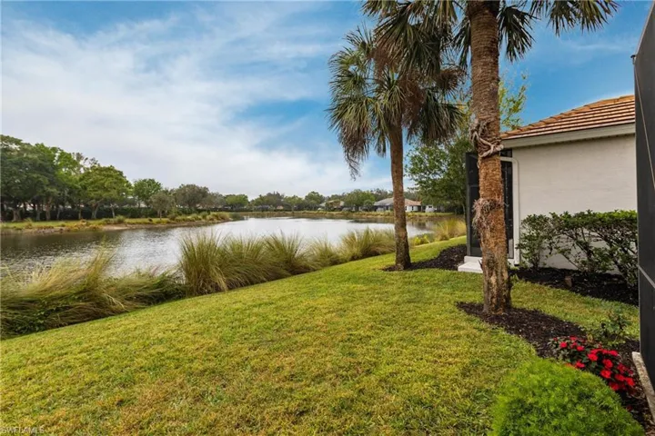 View of yard with a water view
