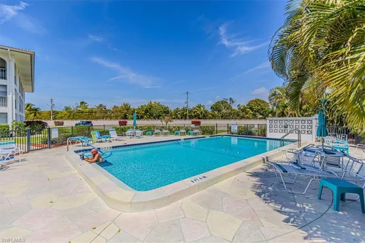 Community pool featuring a patio area