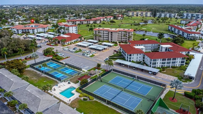Bird's eye view of a nearby body of water and a local golf course