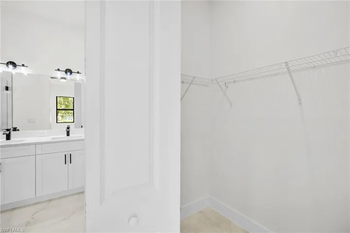 Walk in closet with a sink