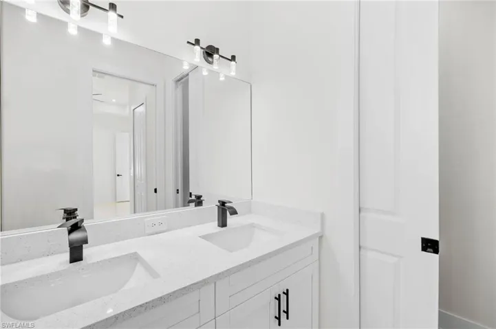Bathroom featuring double vanity