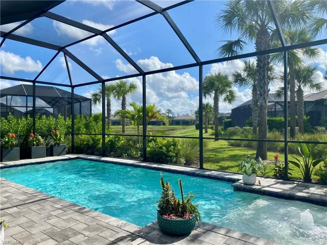 Swimming pool with a lanai and a patio