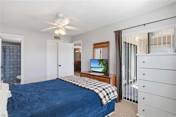 Primary Bedroom with neutral wall paint and light-colored carpet flooring - Virtually Edited Image