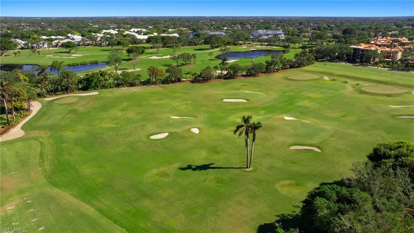 Bird's eye view of a large body of water and a golf course