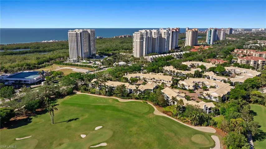 Aerial view of a large body of water and a local golf course